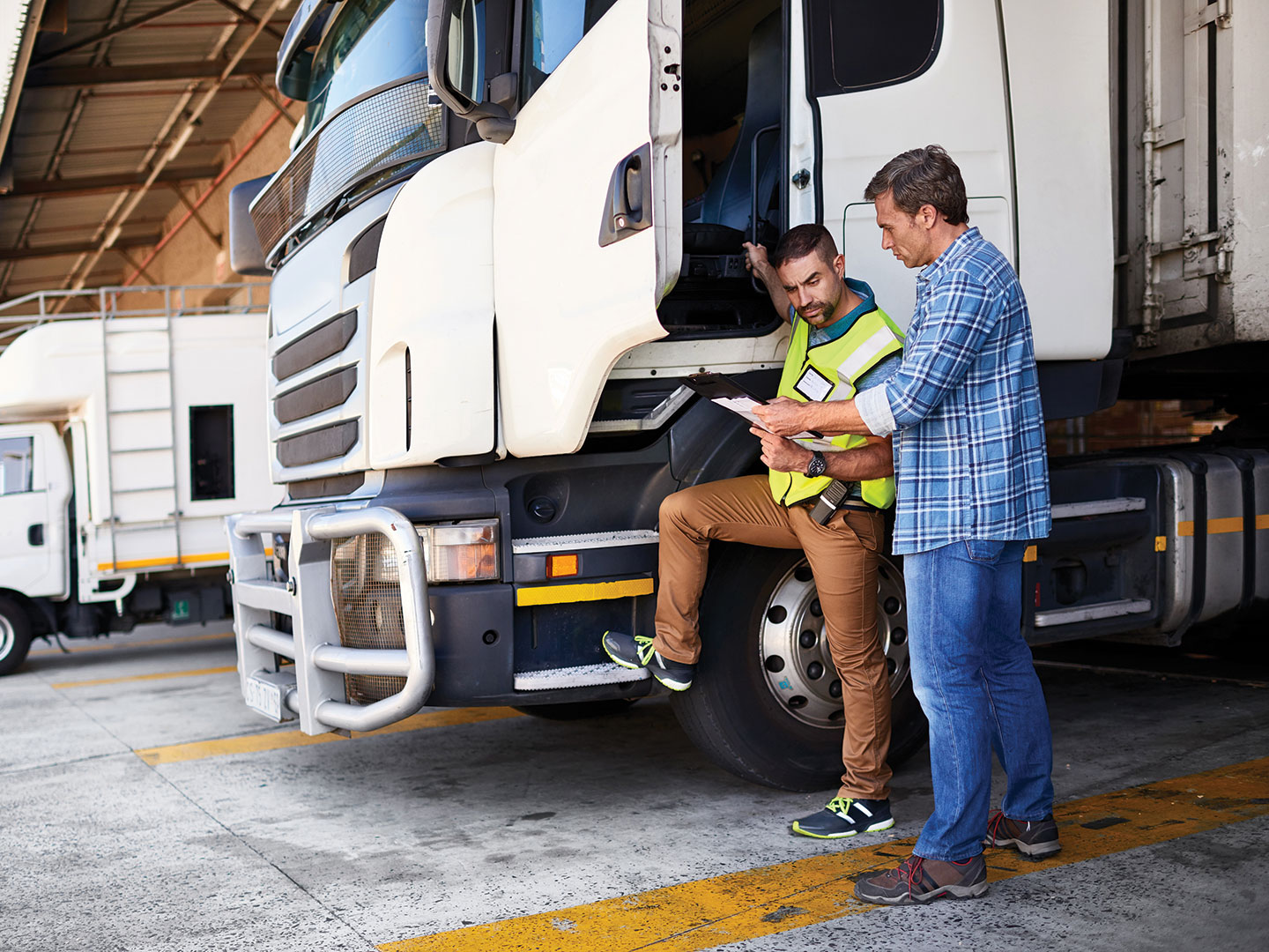 A truck driver gets ready to start his driving route