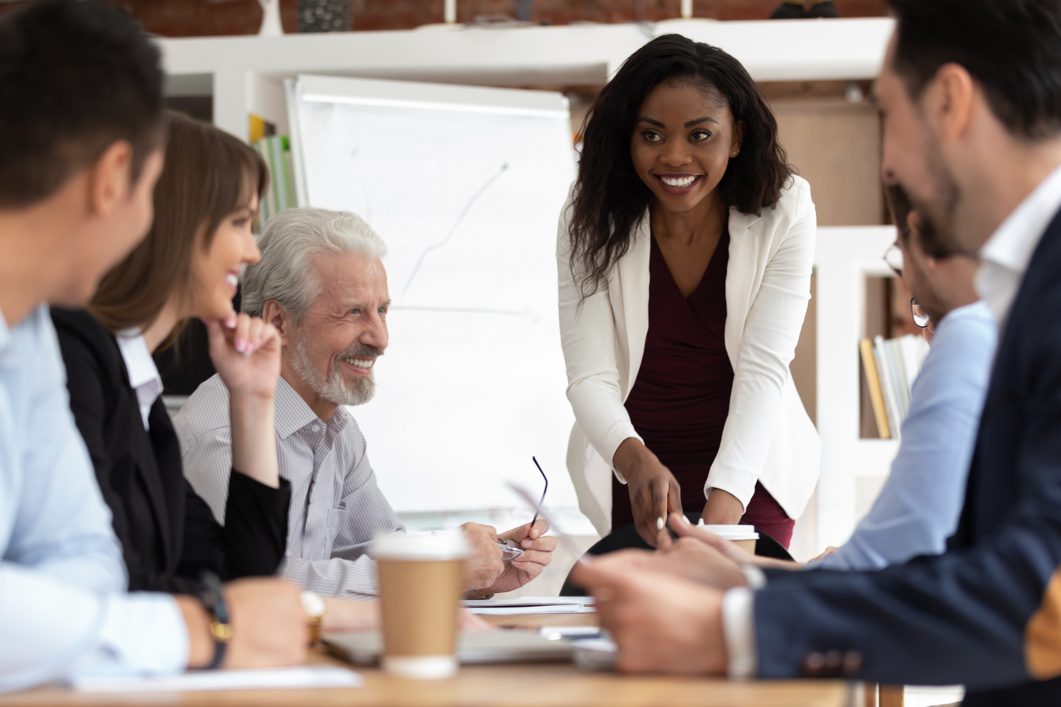 Photo of female businesswoman leading a meeting