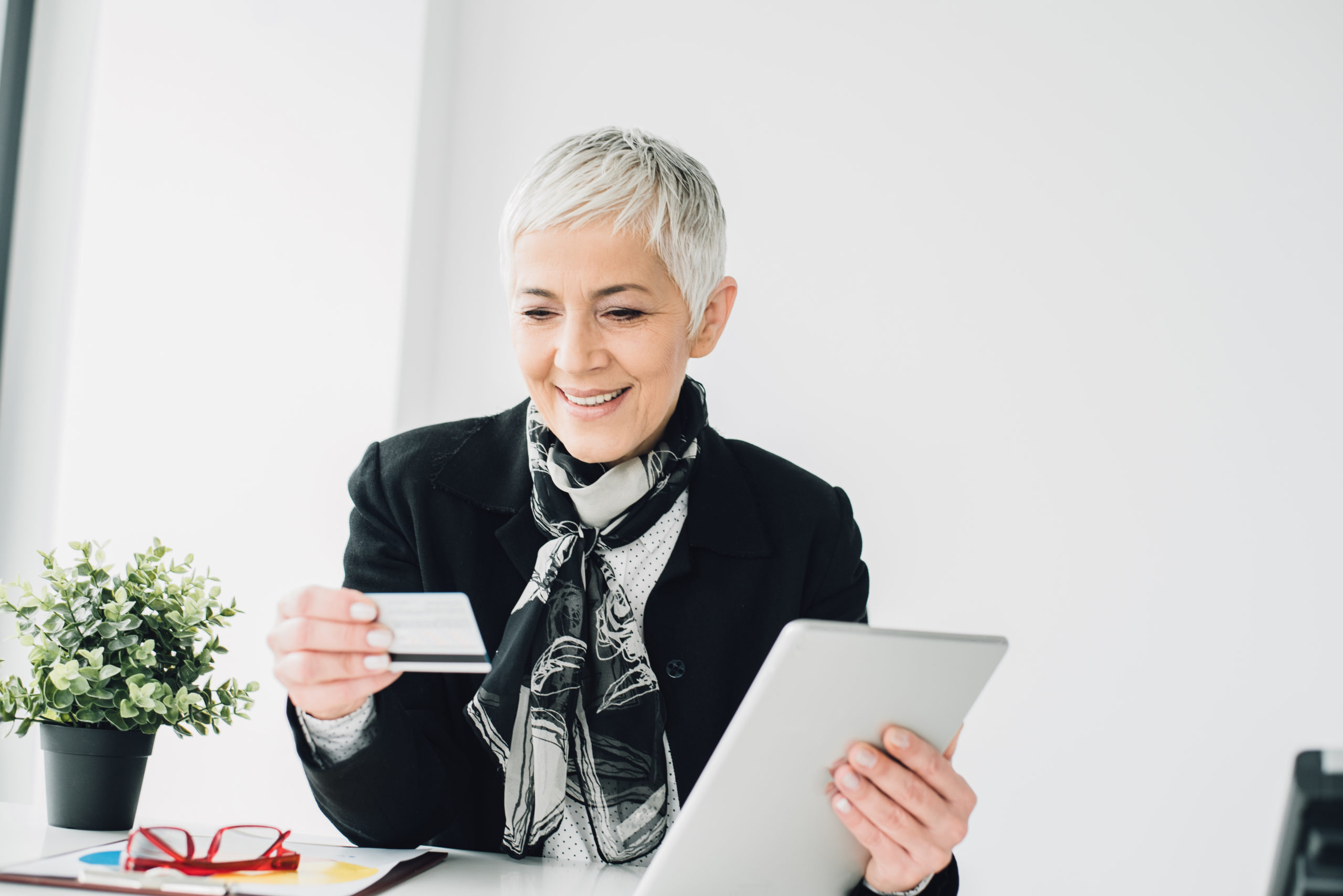 Older woman creating a Corporate Credit Card Policy